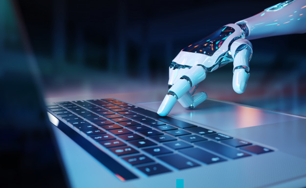 Robotic hand pressing a keyboard on a laptop