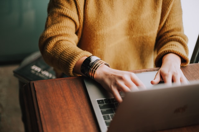 a woman using a laptop to learn how to crack a digital marketing interview