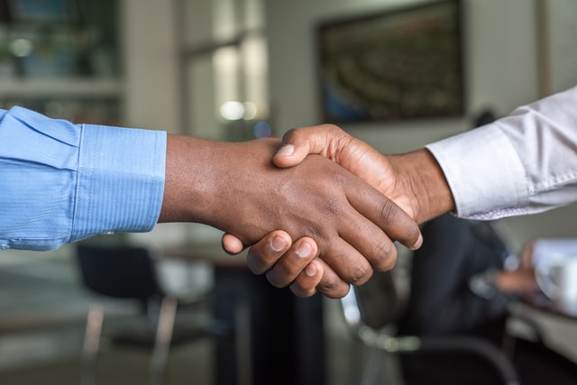 a handshake after a successful job interview. 