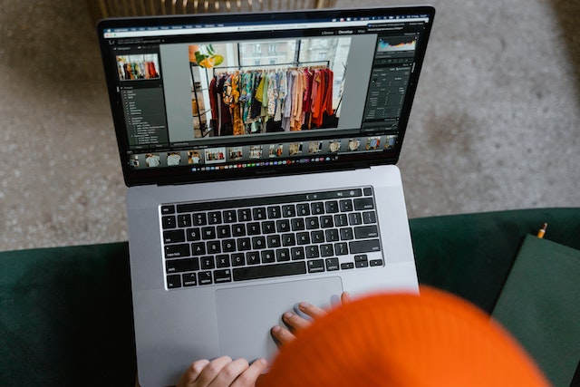 A person creating an online clothing store website